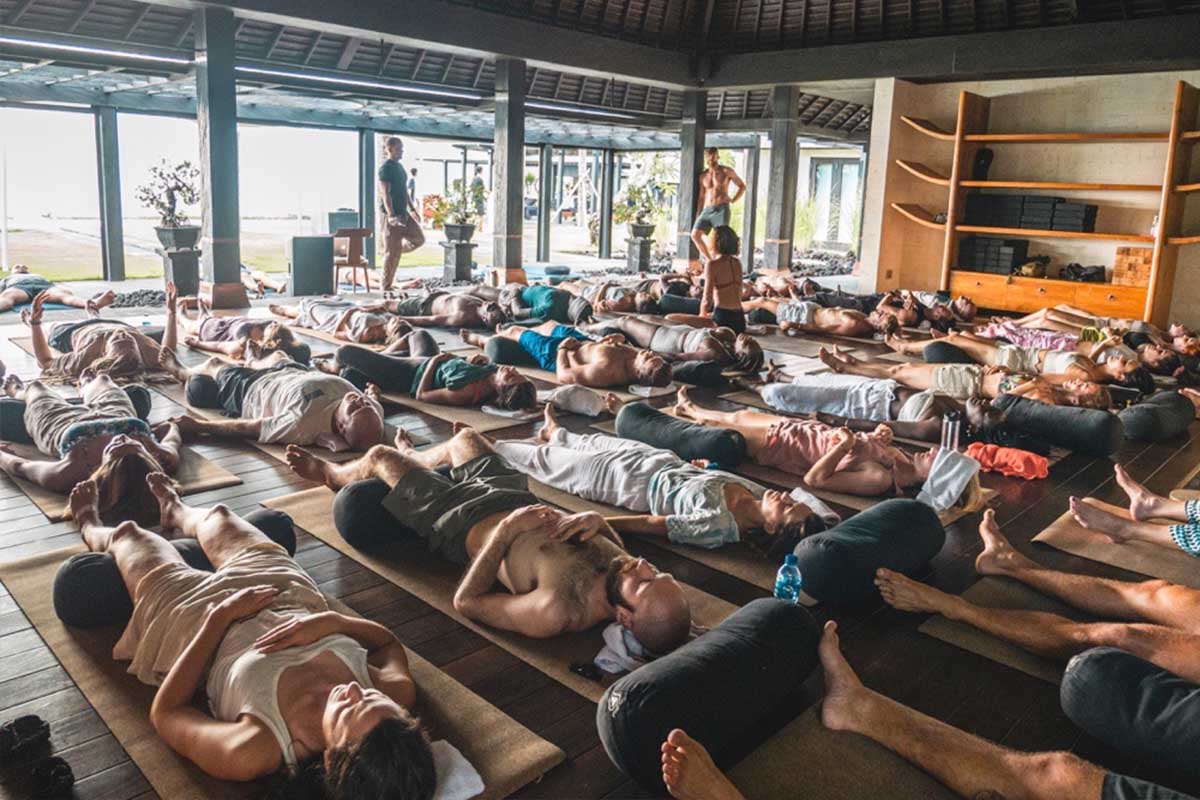 Participants resting on mats during a 9D Breathwork group journey